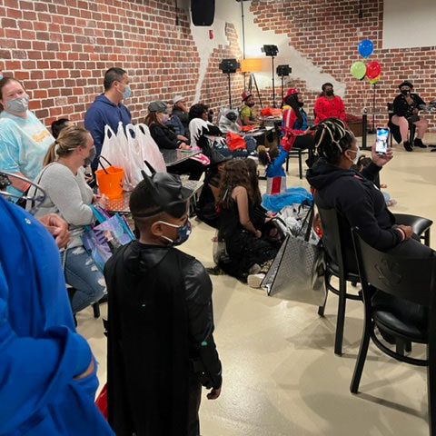 A inside view of children costumed at the Chick-fil-A Southaven Superhero Fall Festival