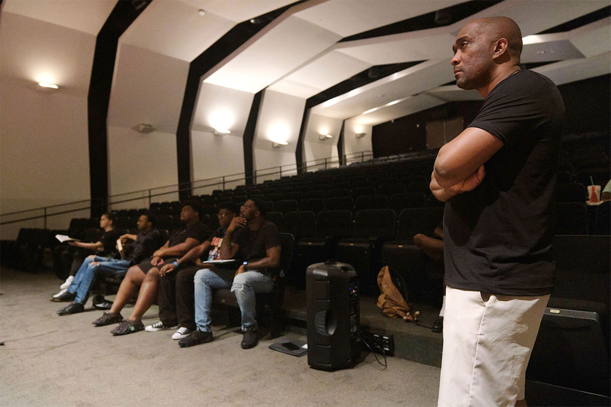 Men sit in a dim auditorium for the Jackson Film Festival
