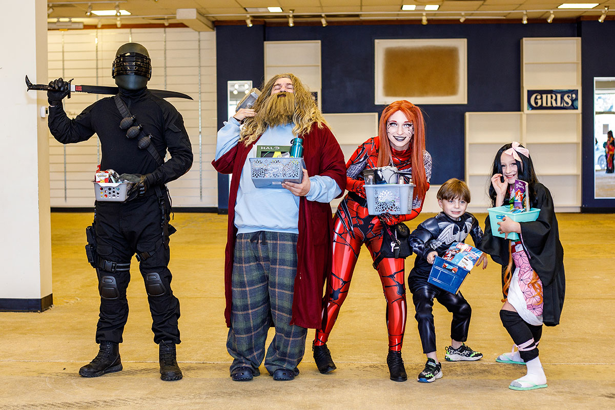 Give people in costume lined up by height for Cosplay with a Cause