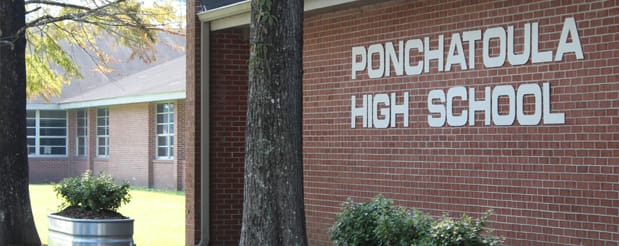 Sign that reads Ponchatoula High School on a brick wall exterior