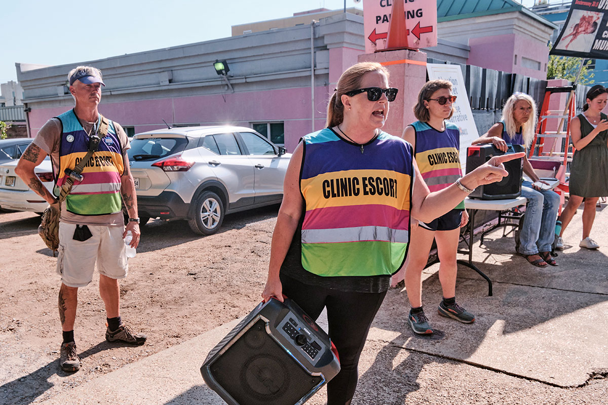 Clinic Escorts defending the entrance to the JWHO clinic parking lot