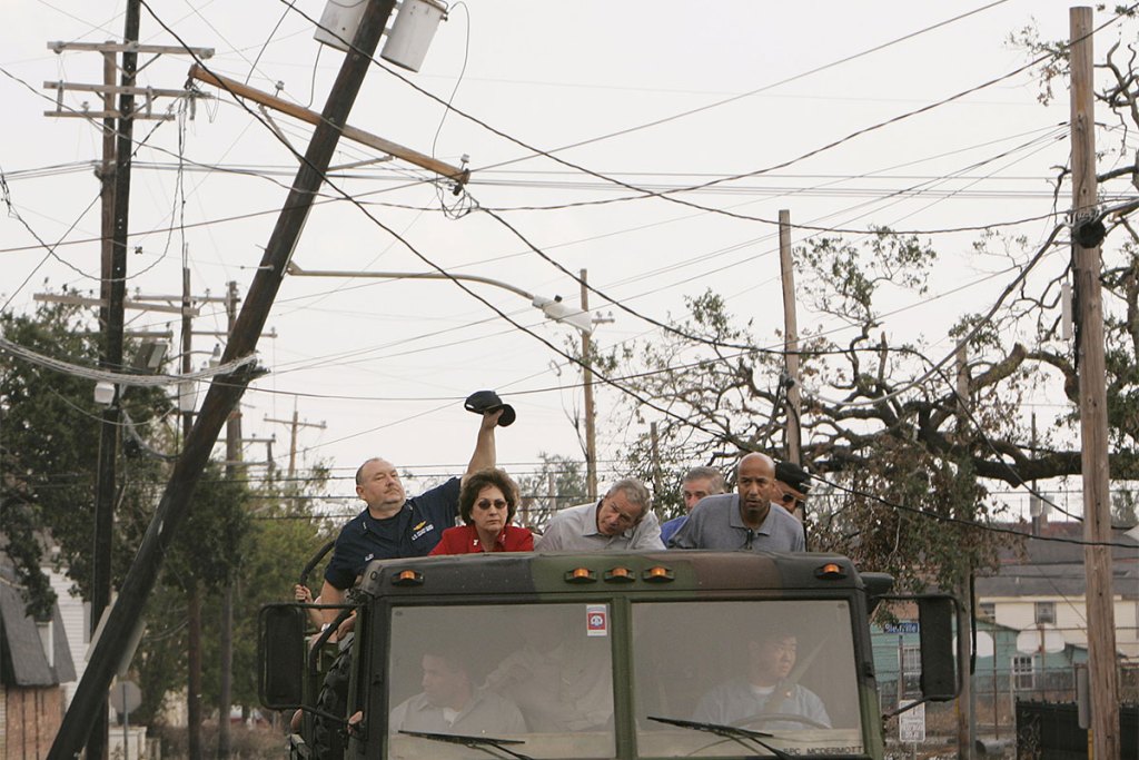 Kathleen Blanco, President Bush, Ray Nagin, and others in a truck survey damage from Hurricane Katrina