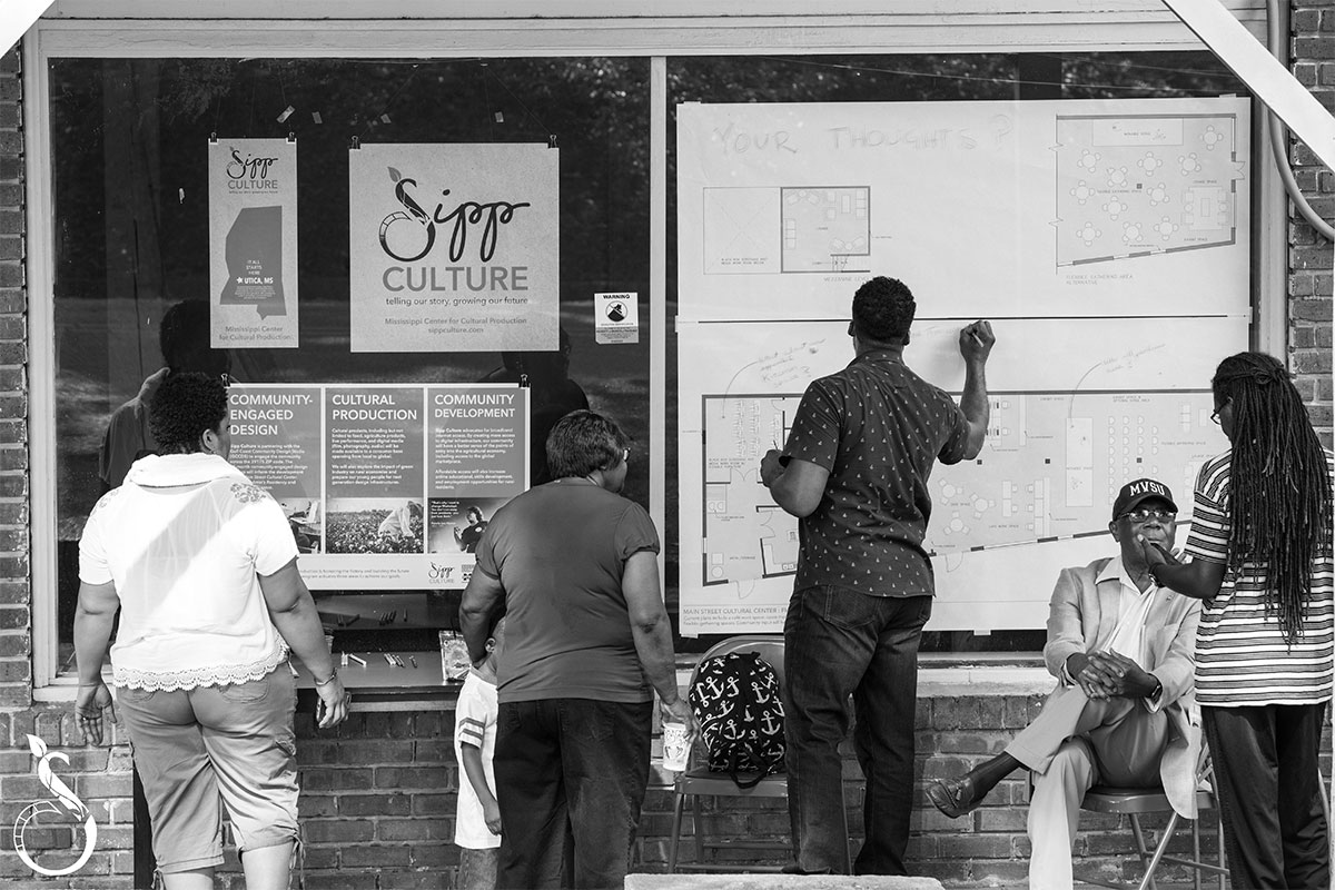Black and white photo of patrons outside of Sipp Culture's Street Cultural Center in Utica, Miss. (Sipp Culture)