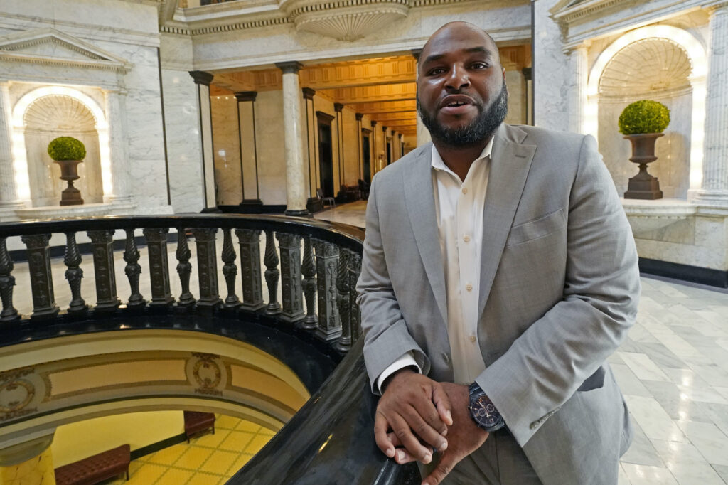 Jarvis Dortch leaning on a railing in the capitol