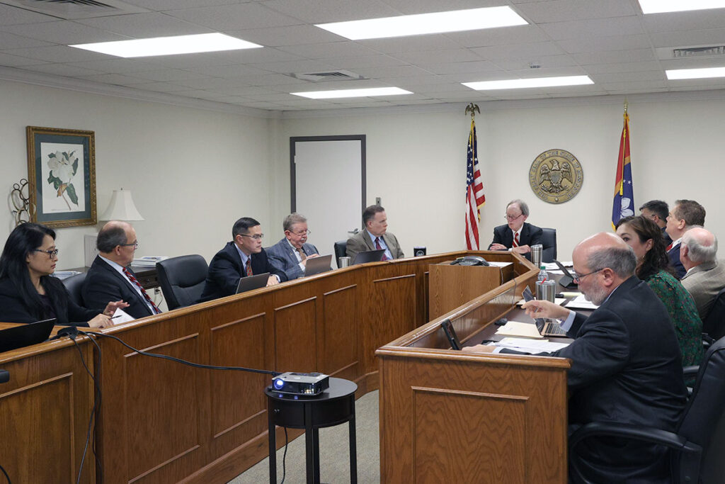 a photo of the members of the Mississippi ethics commission gathered at a meeting