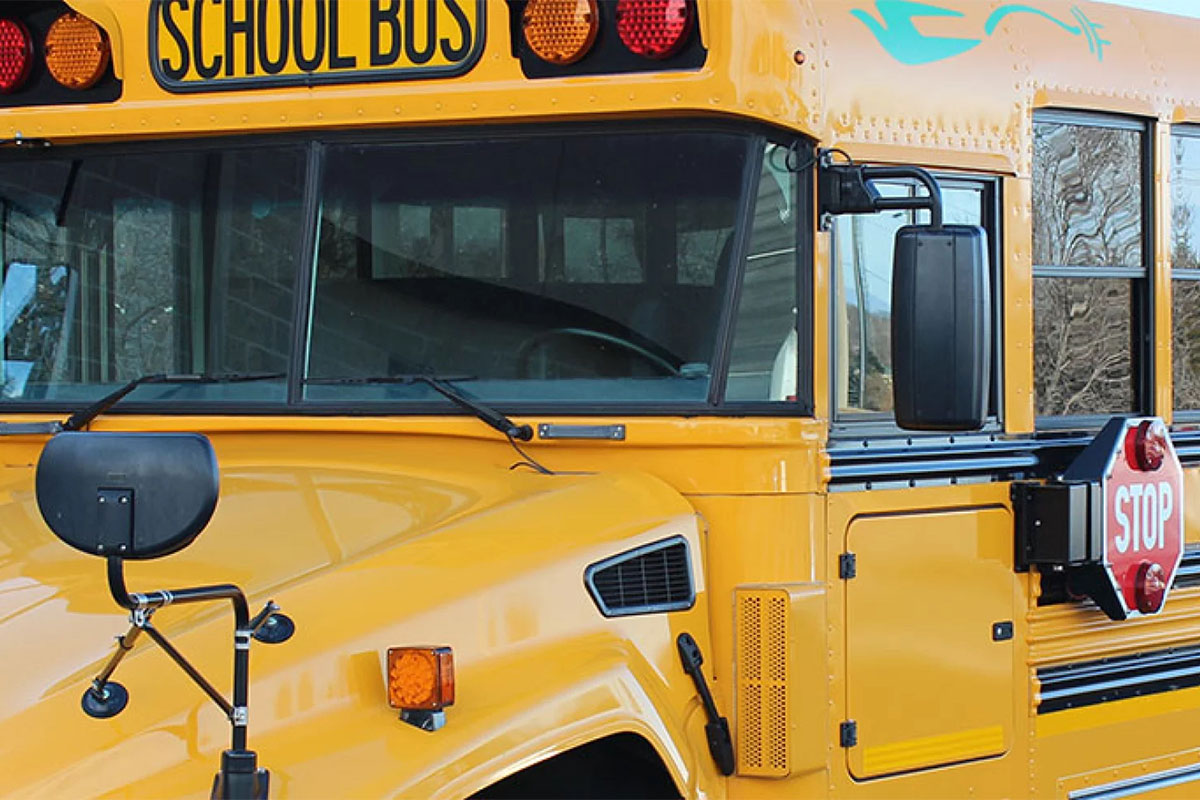 A closeup of an electric school bus