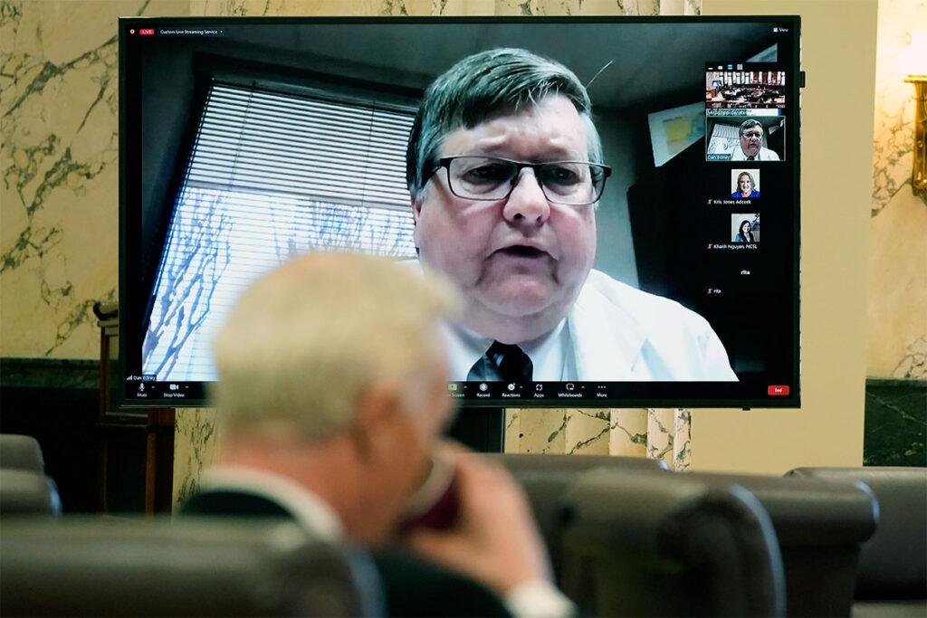 The Senate Medicaid Committee listen to State Health Officer Dr. Daniel Edney via zoom