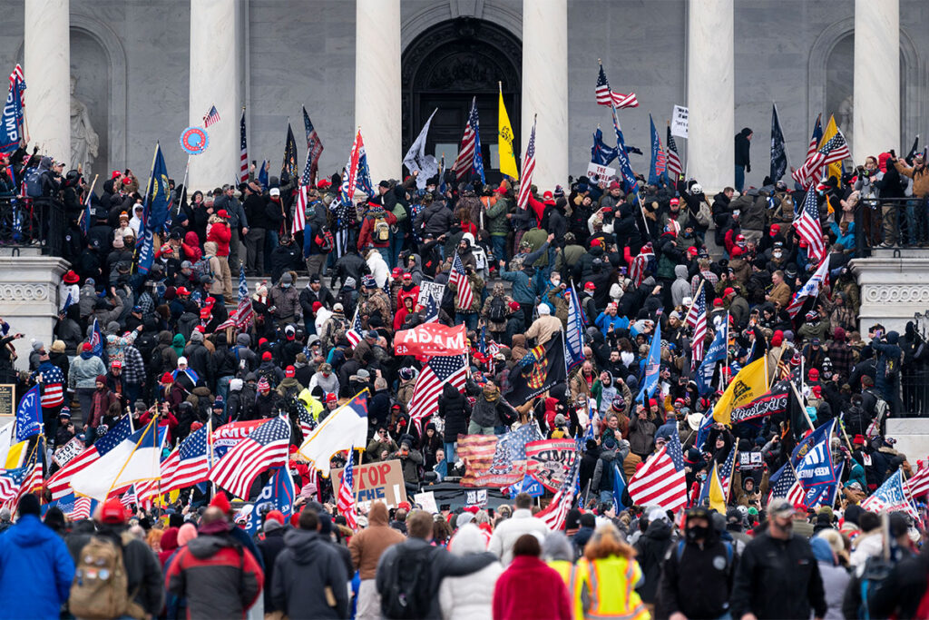 MAGA supporters and others storming on the steps of the US Capitol