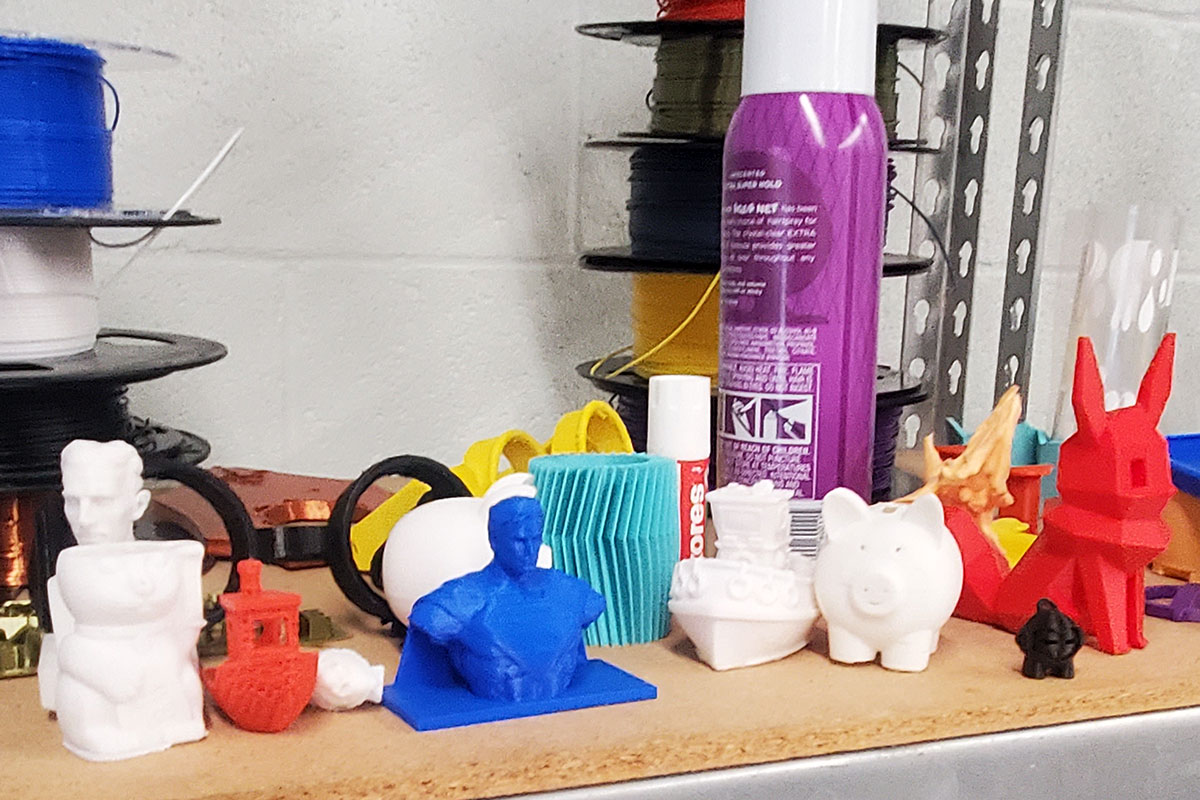 AN assortment of small 3D printed objects in many colors