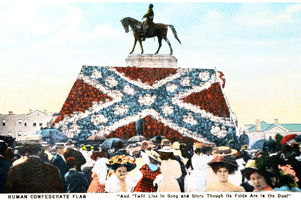 Boys dressed in white and girls in blue and red stand in front of the equestrian statue of General Robert E. Lee on Monument Avenue in Richmond to create a human Confederate battle flag in 1907. (HB 1020)