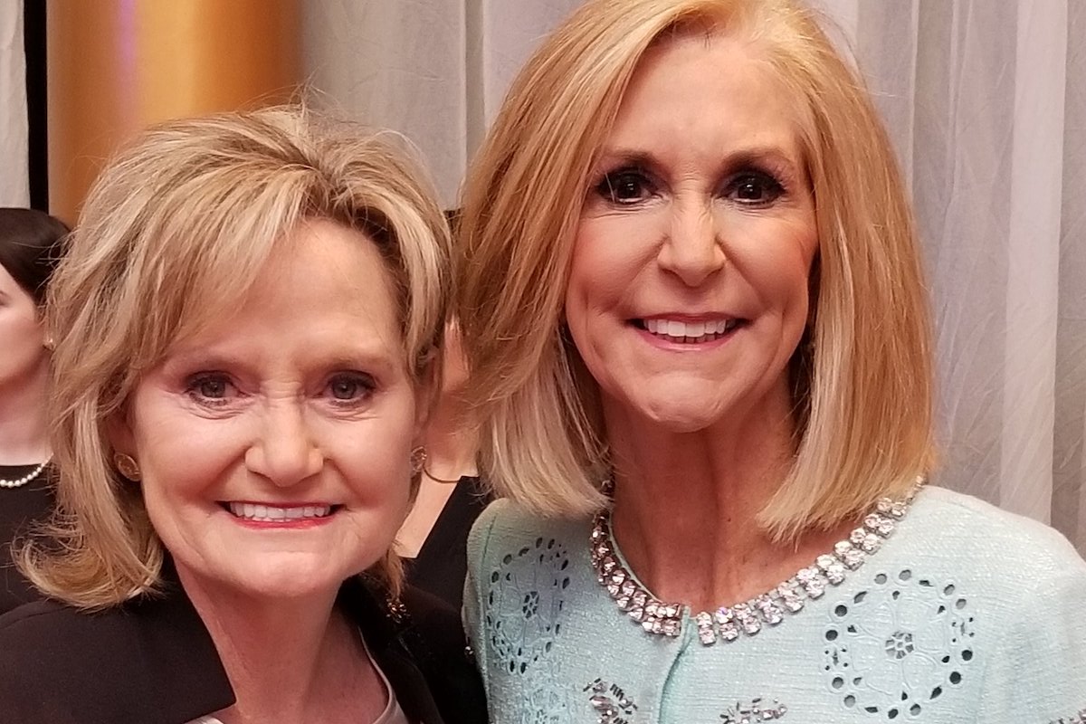 U.S. Sen. Cindy Hyde-Smith and Attorney General Lynn Fitch, both blonde women dressed up for an event and posing together