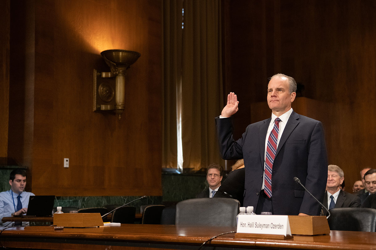 U.S. District Judge Halil S. Ozerden with his hand raised at a US Senate hearing