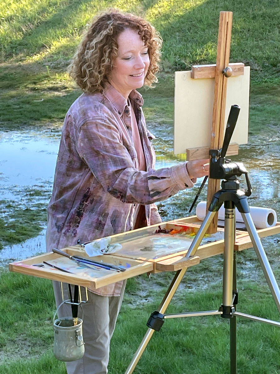 Carol Web painting outside