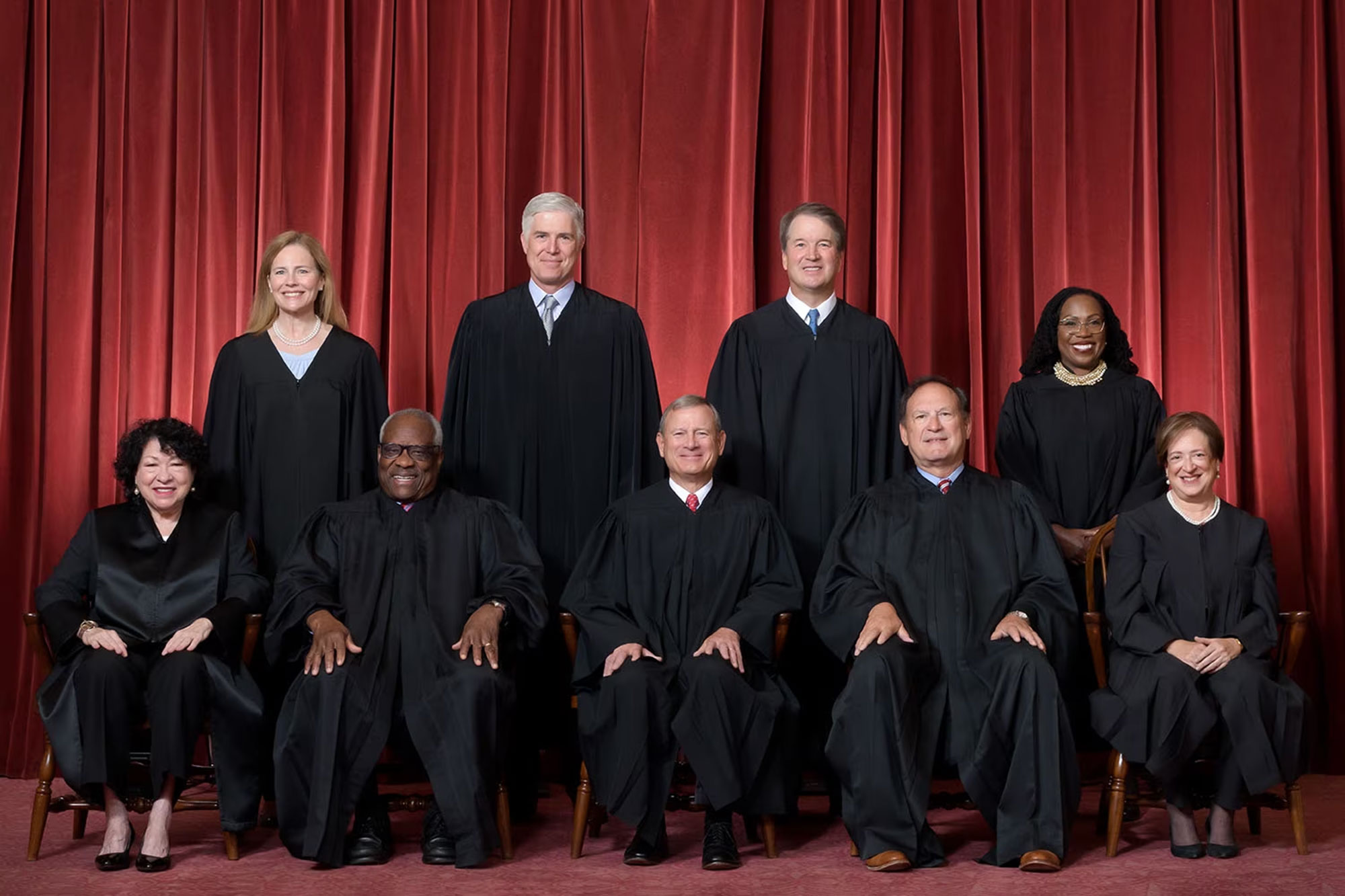 US Supreme Court justices sitting and standing in black robes (Affirmative Action)