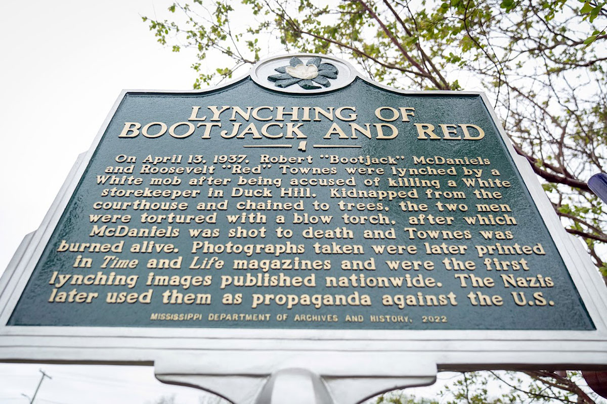 Sign with the title Lynching of Bootjack and Red