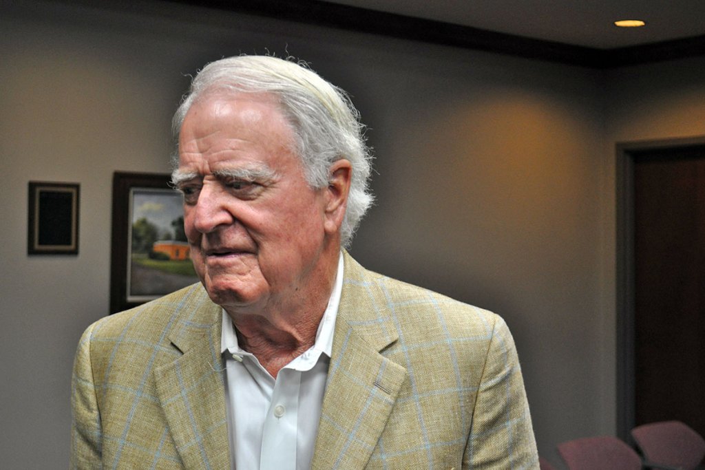 John McGowan looking to the left inside a room