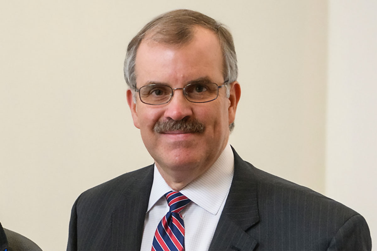 Headshot of Paul Caffera in a suit