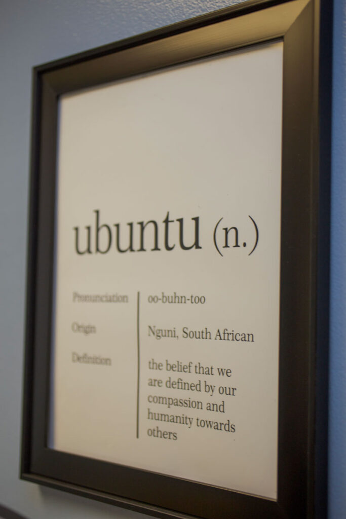 A sign that defines Ubuntu: the belief that we are defined by our compassion and humanity towards others