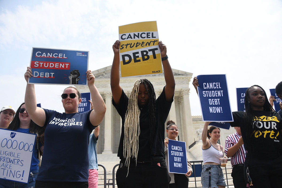 Supporters of student debt forgiveness demonstrate outside the US Supreme Court in Washington, DC.