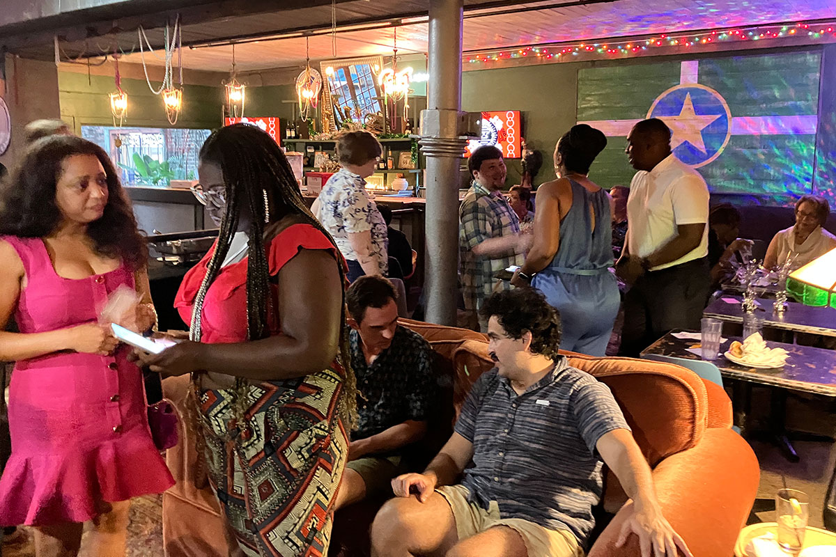 A crowd of people at the MFP Lounge