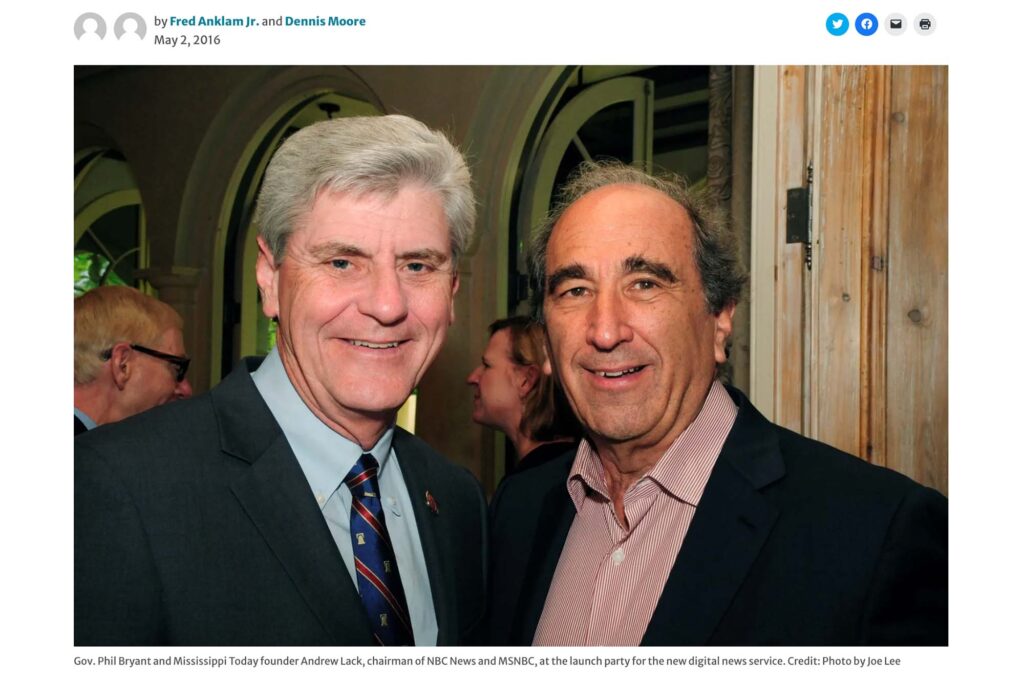 a screenshot of a Mississippi Today article shows Phil Bryant with Andrew Lack and the caption that says "Gov. Phil Bryant and Mississippi Today founder Andrew Lack, chairman of NBC News and MSNBC, at the launch party for the new digital news service. Credit: Photo by Joe Lee"