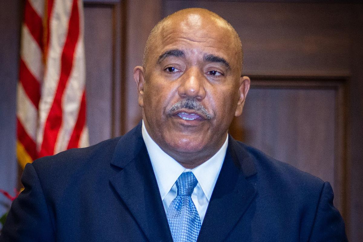 a chest-up photo of David Archie in a suit and tie