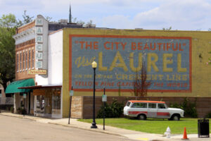 A fading mural is on the side of the Marcus Furniture store near downtown Laurel, MS