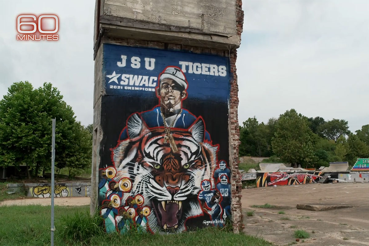 A mural of JSU Tigers SWAC 2021 Champions with Deion Sanders and a large tiger