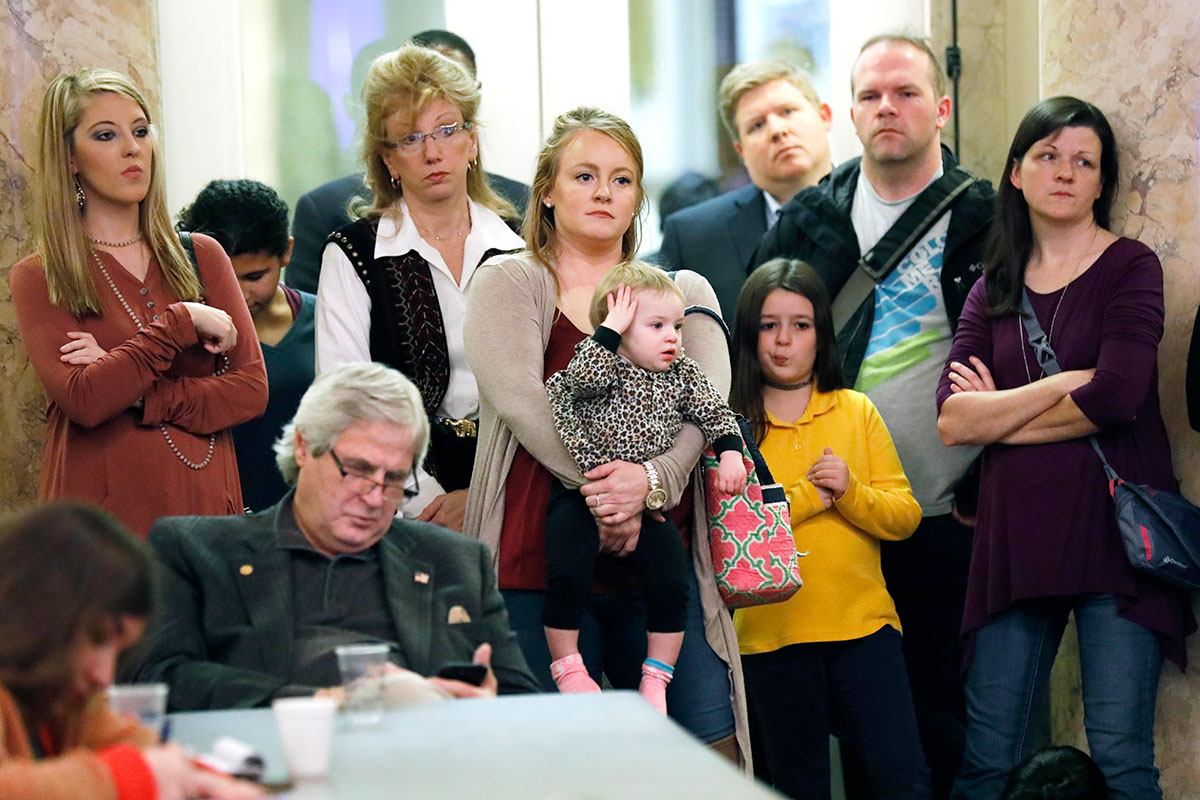 Parents with their children and medical professionals listen to testimony from people who want Mississippi to allow a religious exemption from the vaccination requirements for school attendance