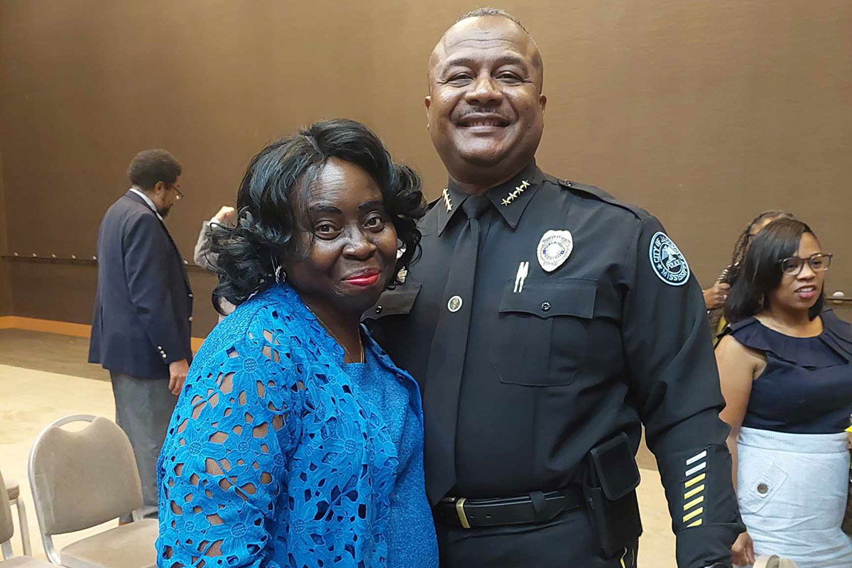 Nancy Gaynor posing beside police chief Joseph Wade