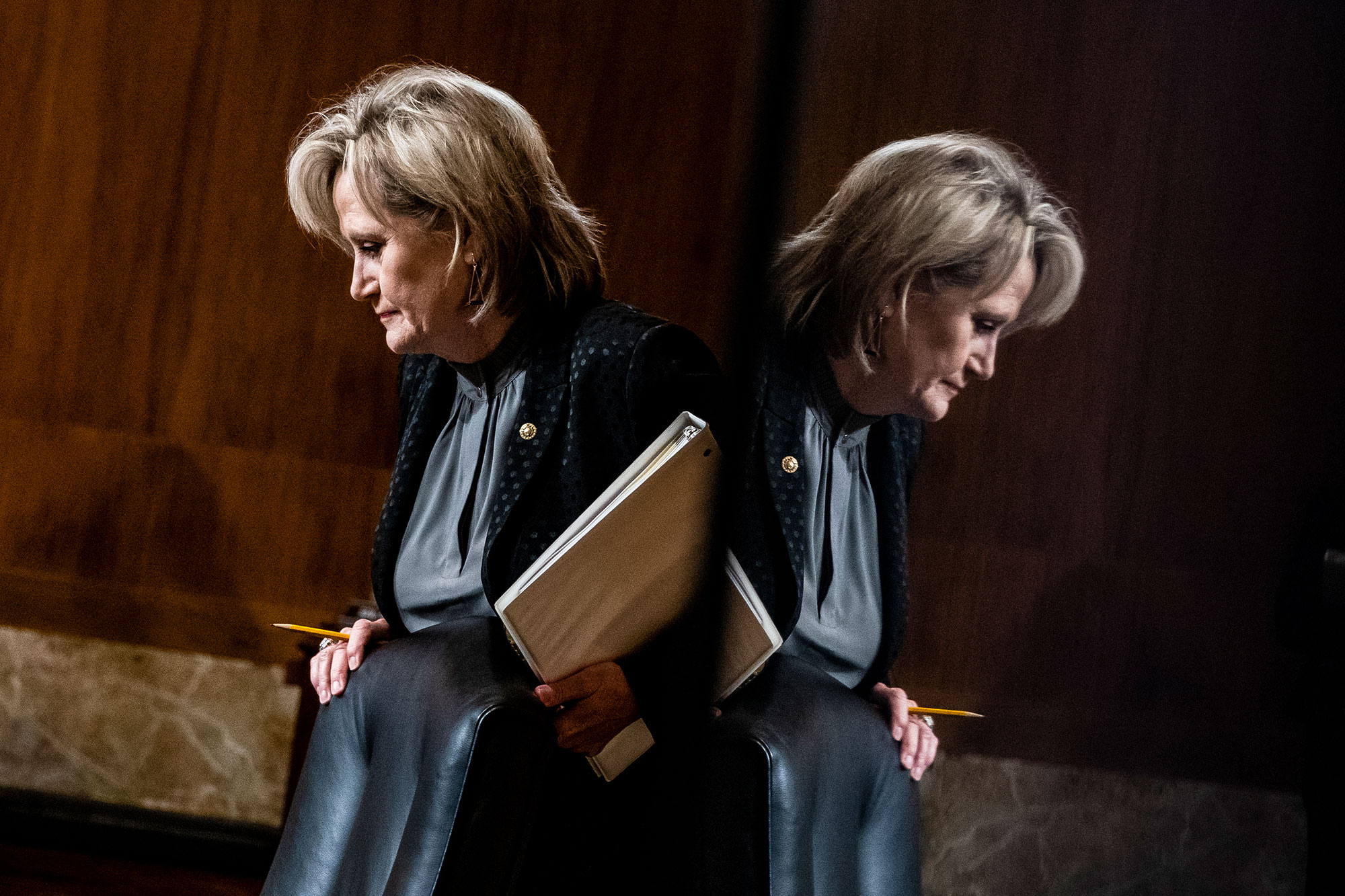 Sen. Cindy Hyde-Smith seen in duplicate by a mirror reflection