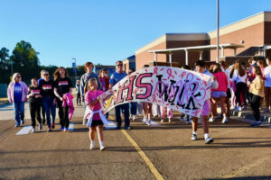 Many students walk with a a OHS Pink Walk banner