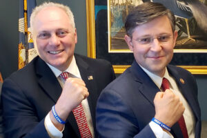 Steve Scalise and Mike Johnson wearing "Pray Louisiana" wrist bracelets