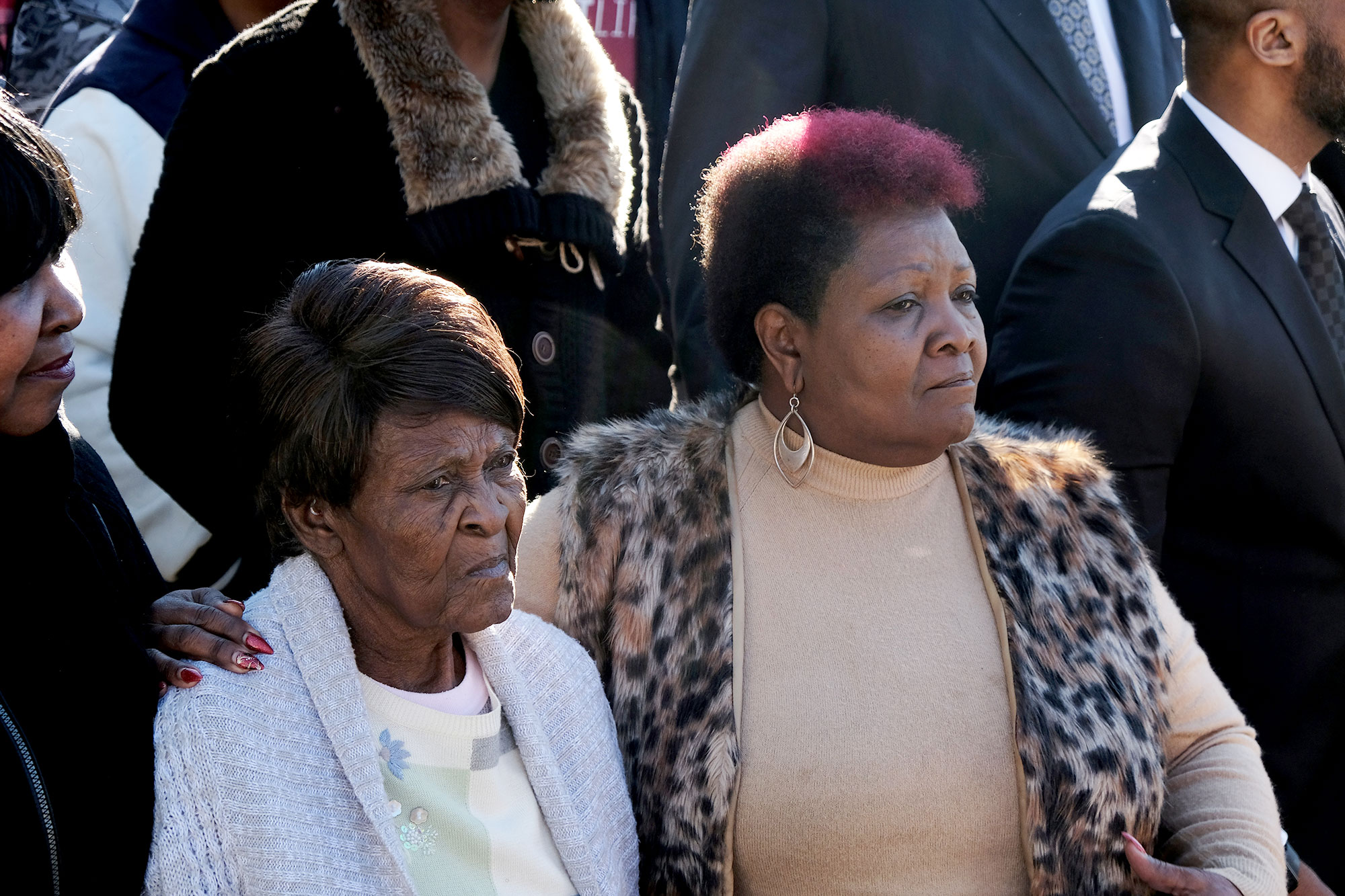 Vernice Robinson and daughter Bettersten Wade embrace in a crowd