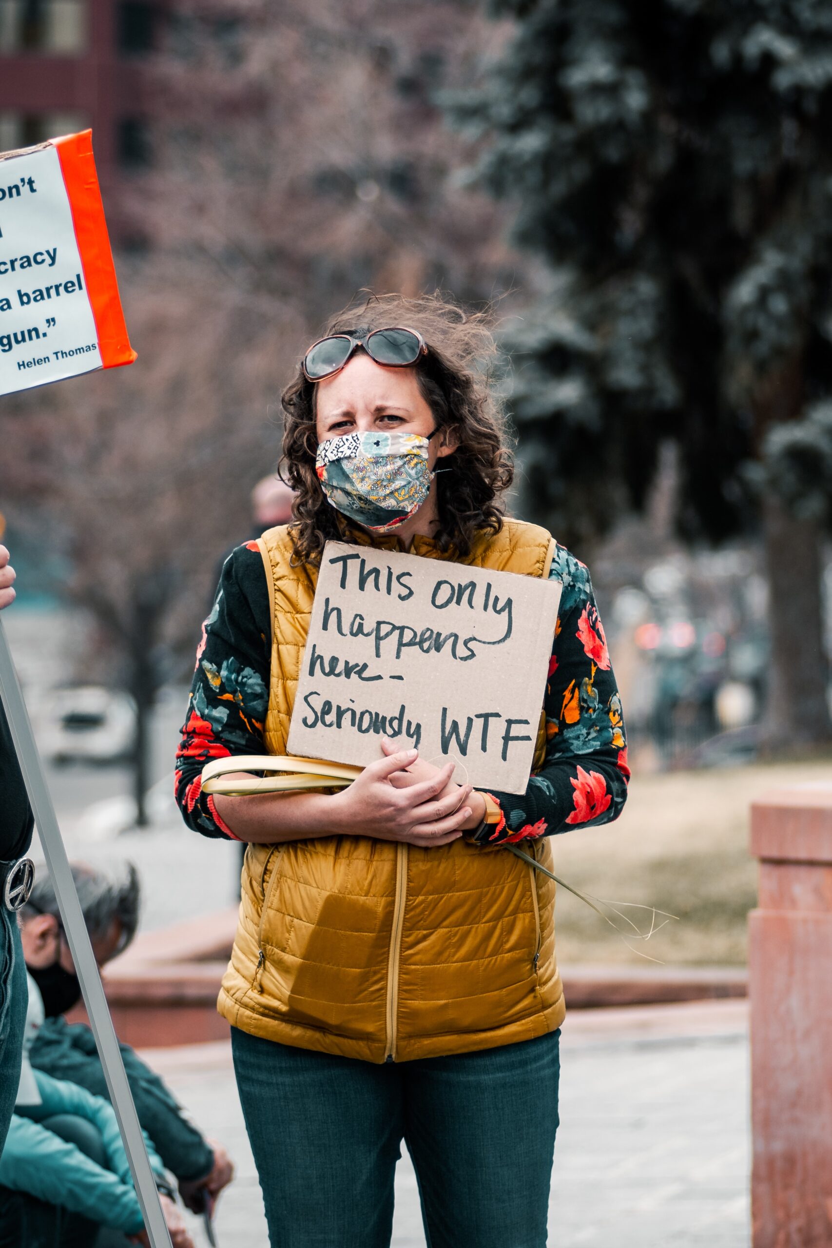 woman wearing a mask during a mass shooting protest 