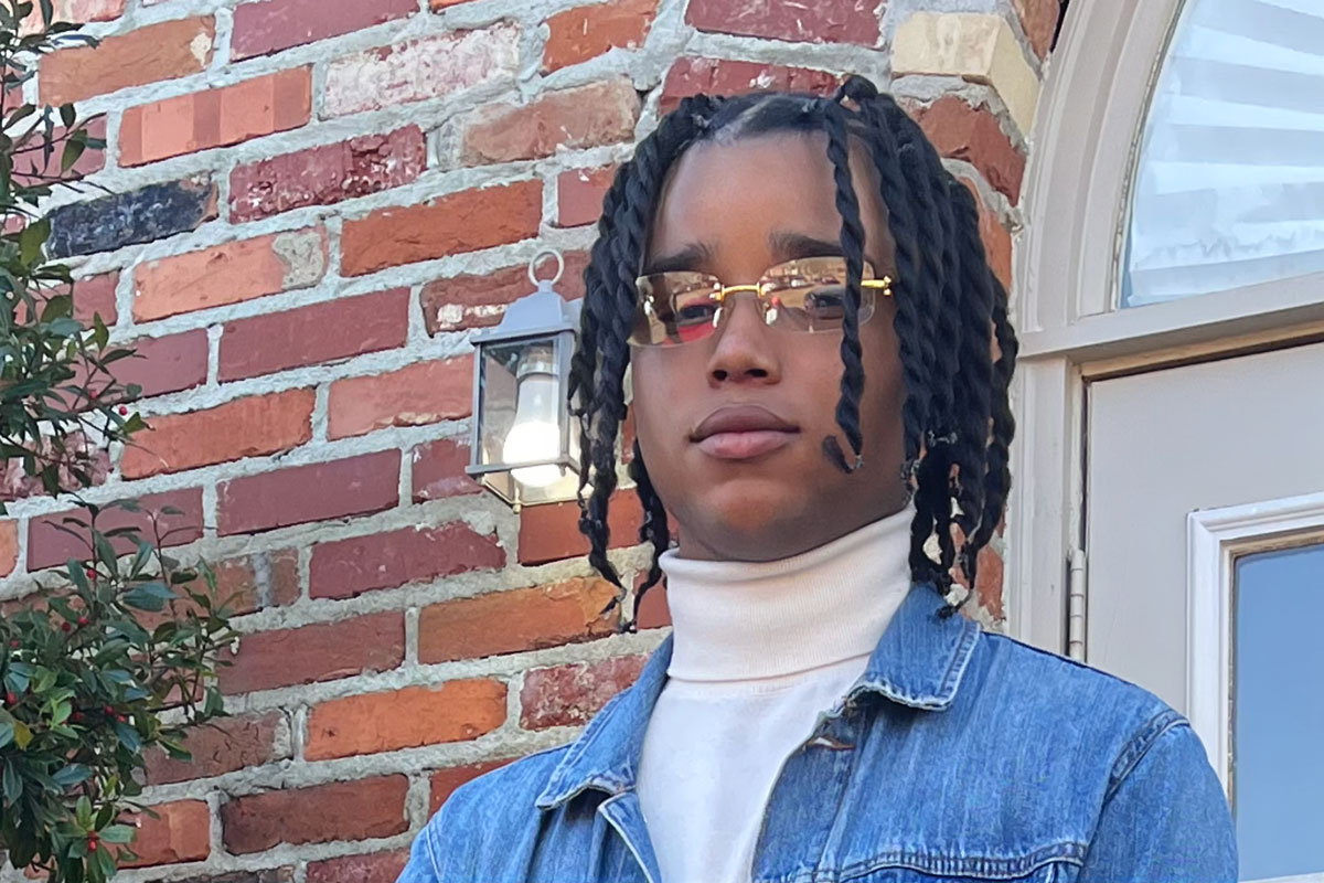 D'Monterrio Gibson standing outside of a red brick building