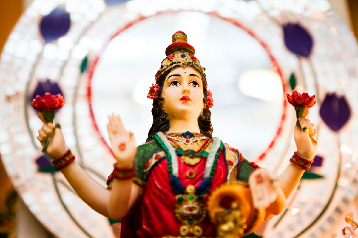n idol of the Hindu goddess Lakshmi that shows her with four hands.