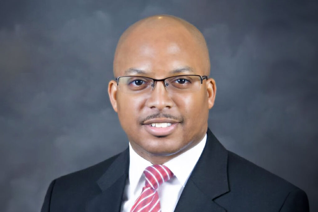 Official headshot of Dr. Marcus L. Thompson