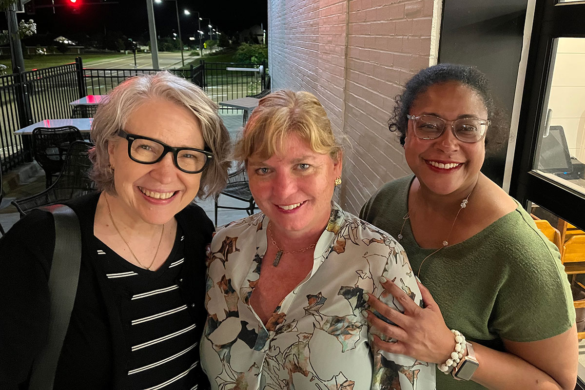 Donna Ladd, Cristen Hemmins and Kimberly Griffin pose together on a patio
