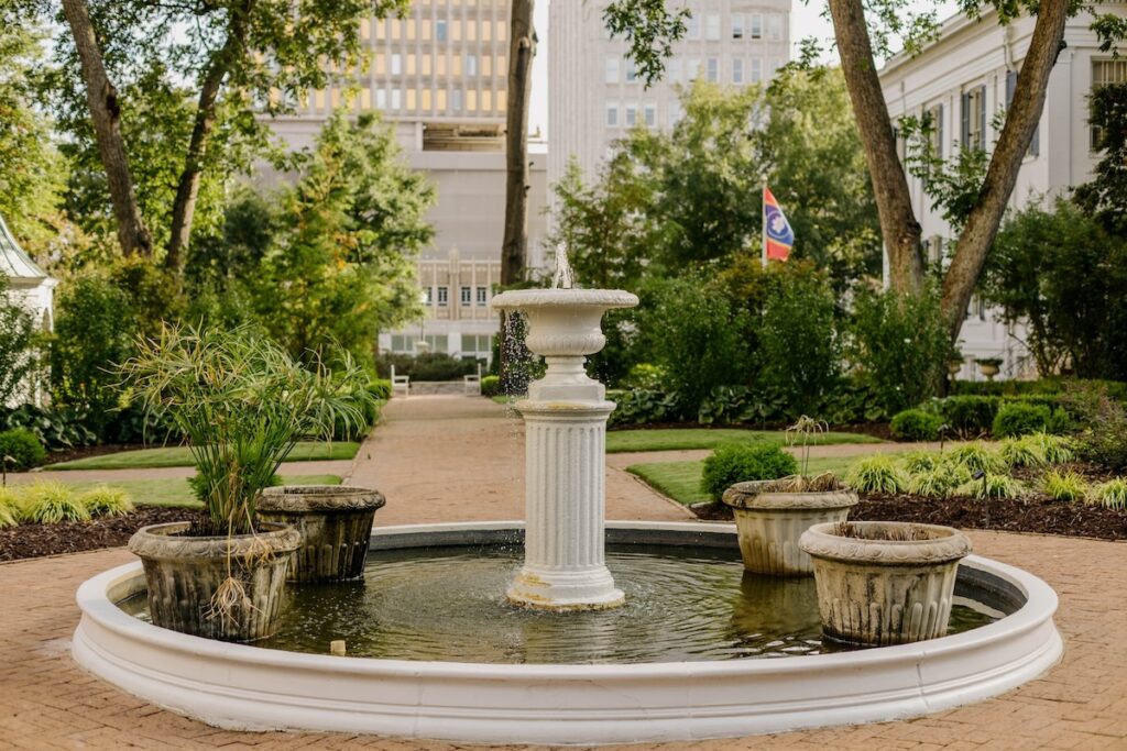 photo shows a fountain outside near the governor's mansion