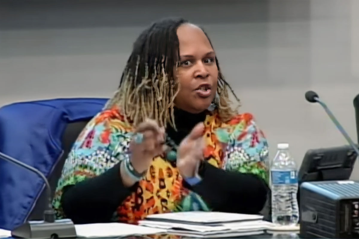 Cynthia Thompson speaking from a desk