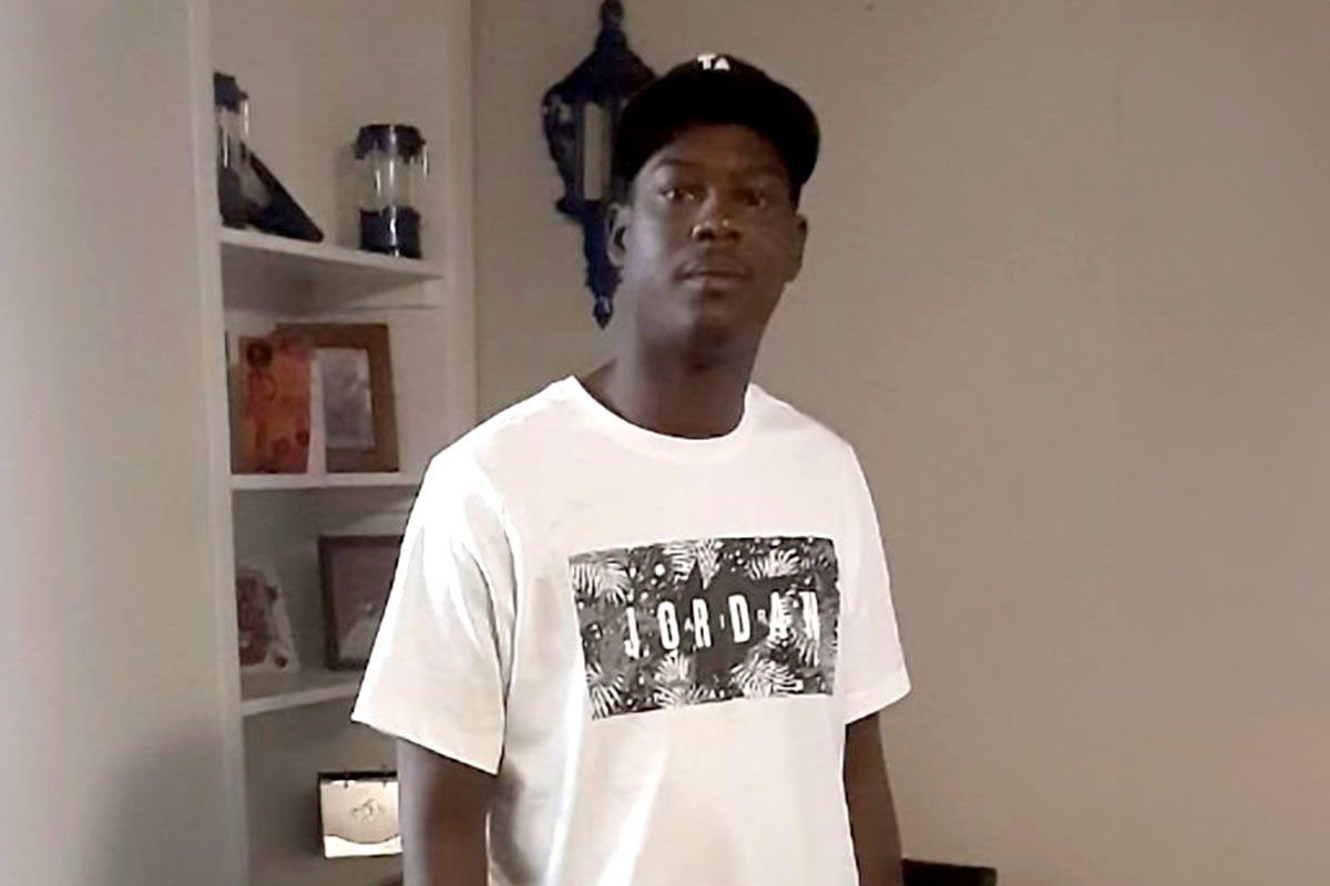 Darius Williams standing inside a living room