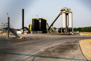 An asphalt plant sitting in a paved area
