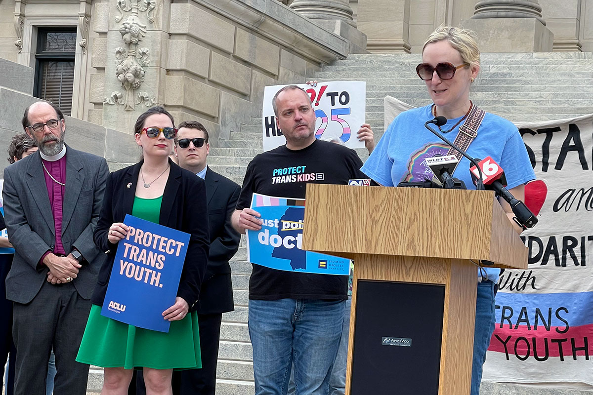 Pro-trans youth protestors with signs