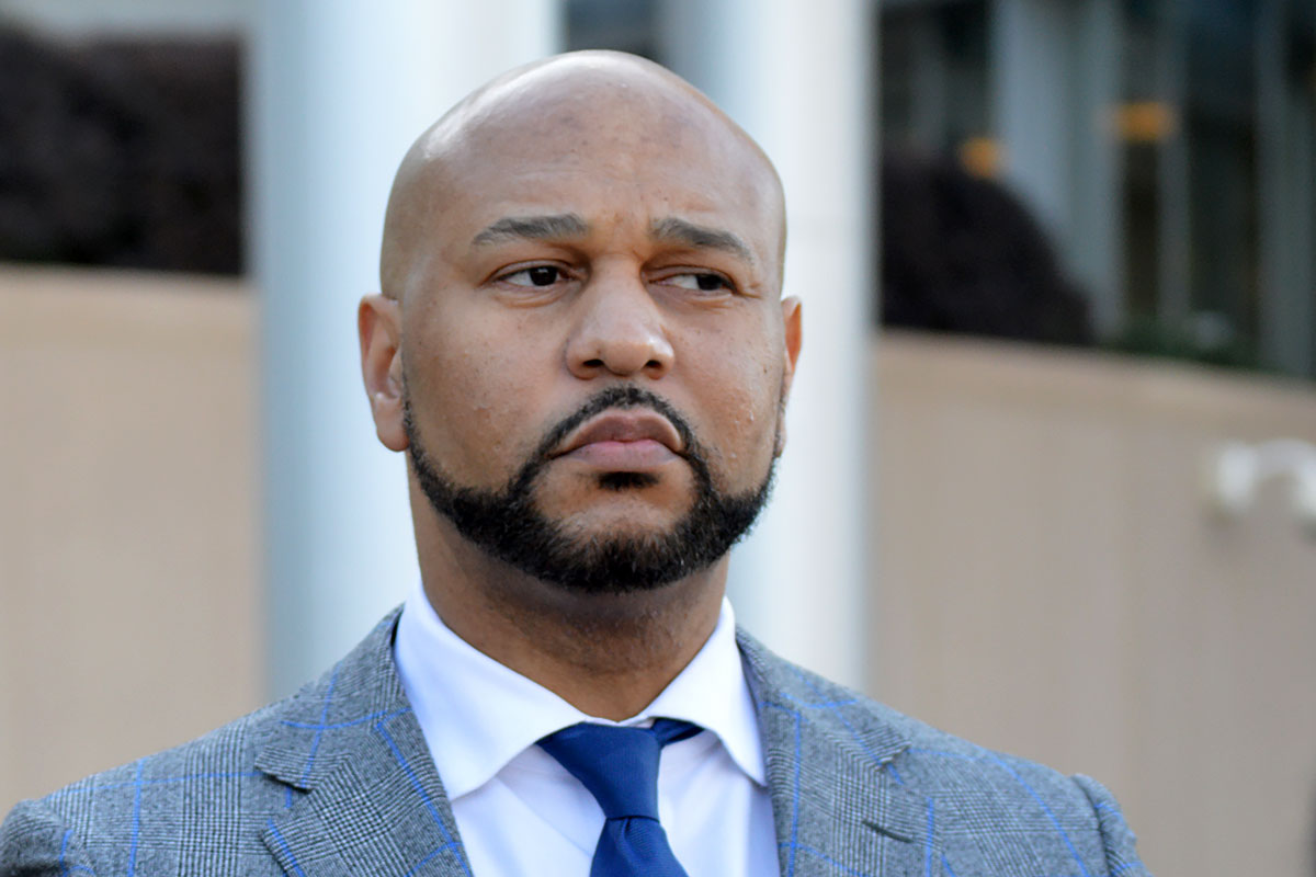 Headshot of Carlos Moore looking to the right
