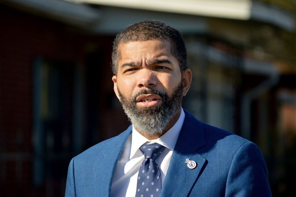 Mayor Chokwe Antar Lumumba in a blue suit, standing outside