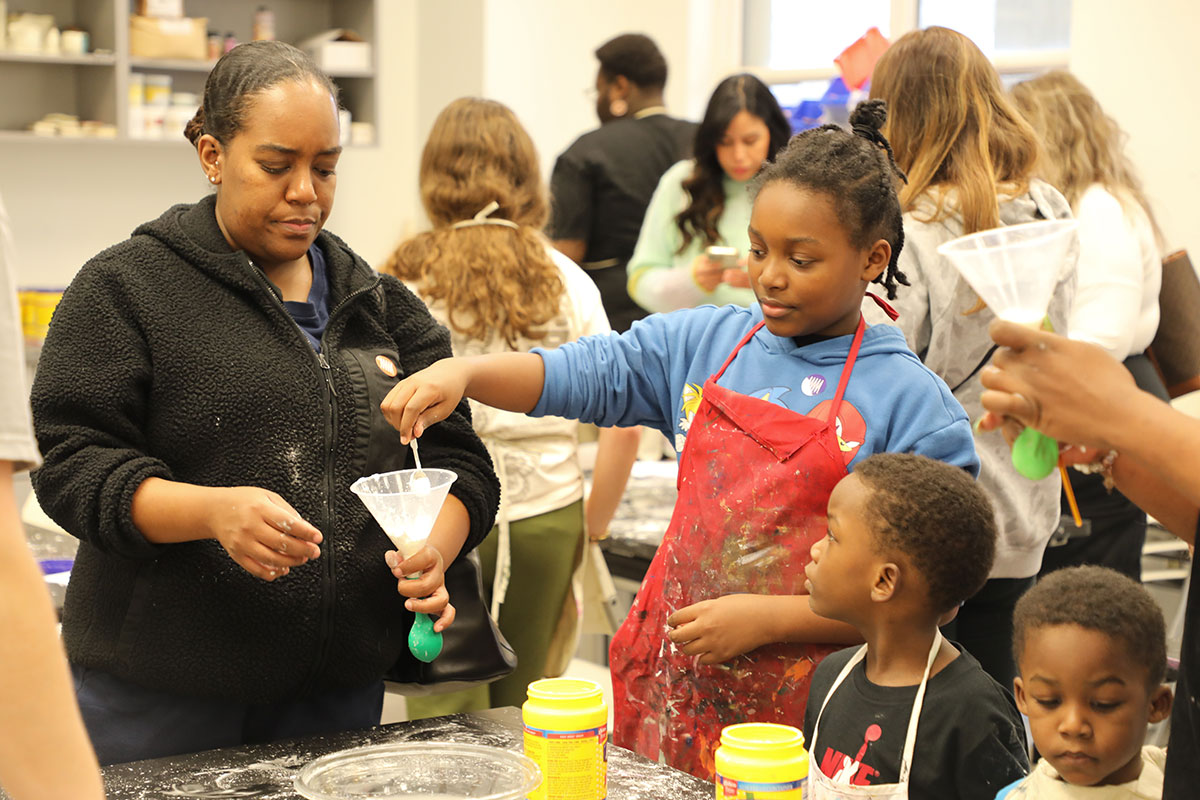Parents and children work together on crafts