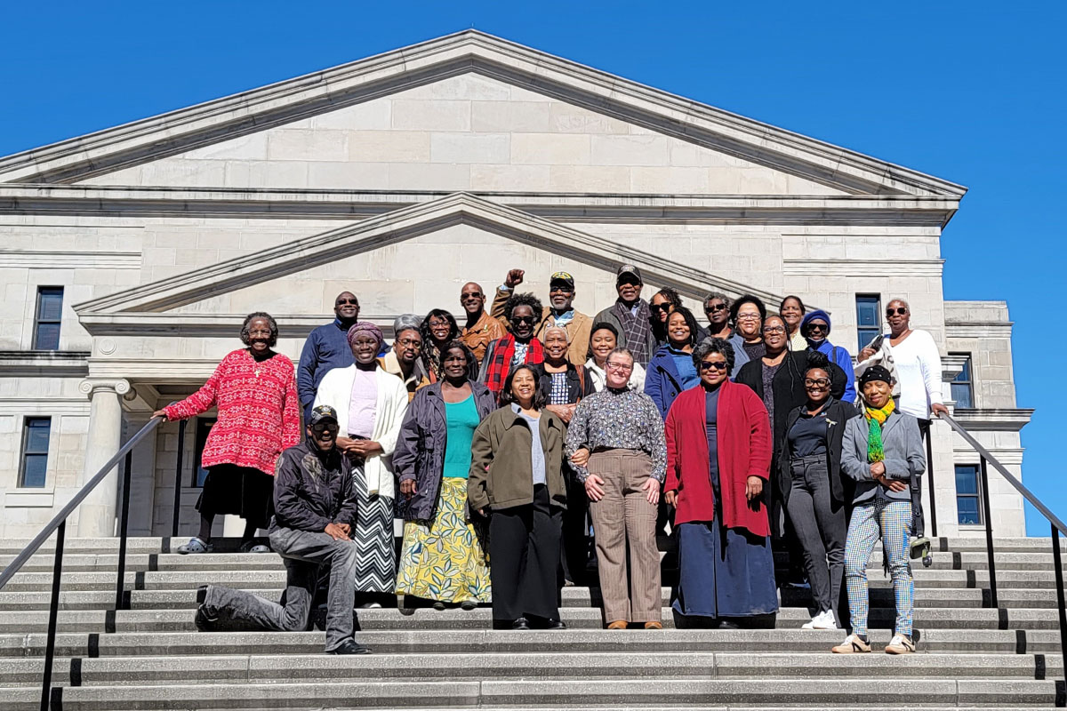Group of people standing outside of a courthouse