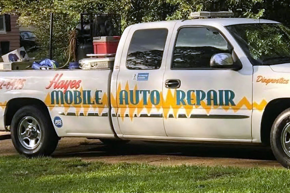 A white truck labeled Hayes Mobile Auto Repair