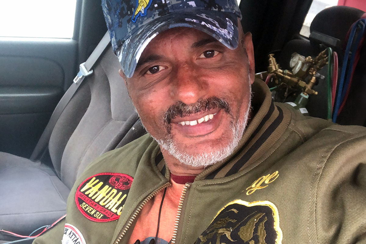 A man's selfie taken inside of a truck